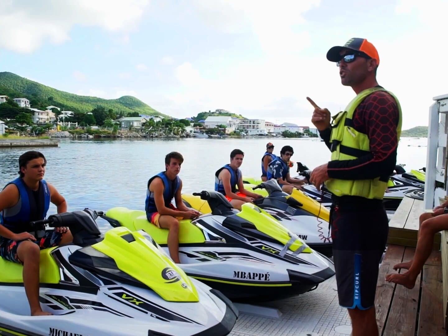 On the pontoon, the guide briefs guests already sitting on their jet skis