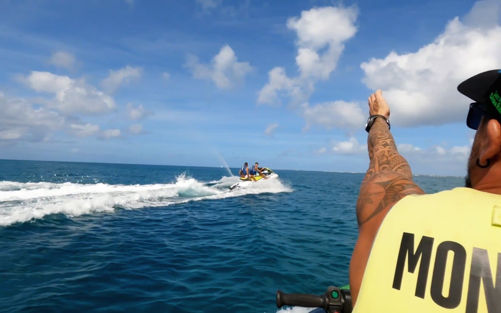 The guide points the way to the jet ski ahead, two people on board