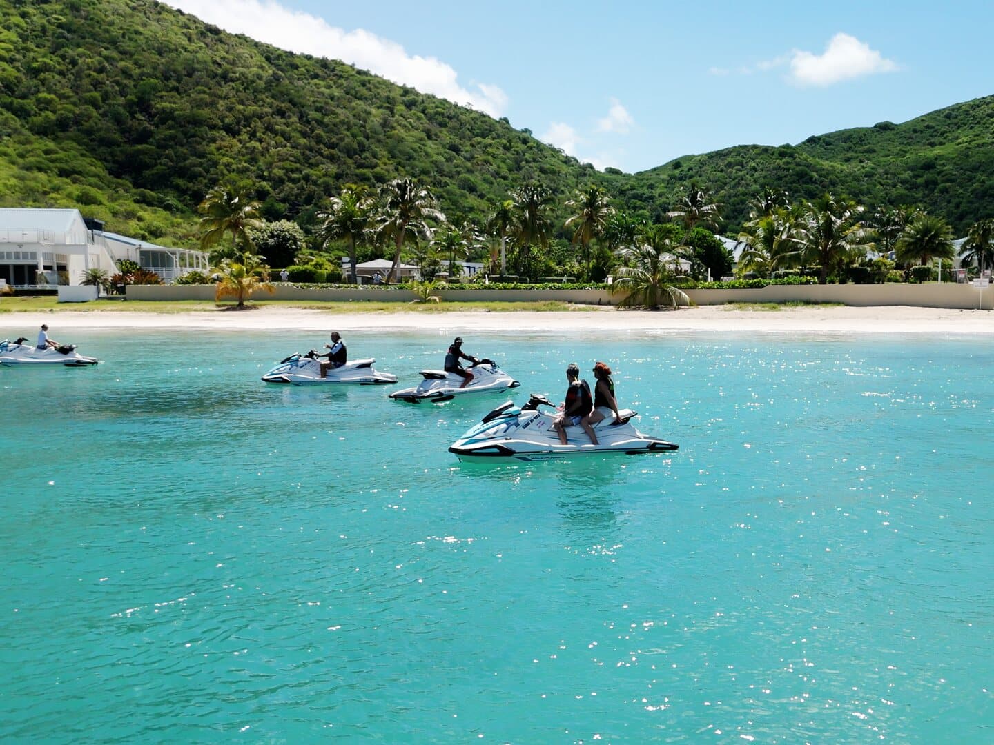 Jet skis waiting as a group off Anse Marcel beach