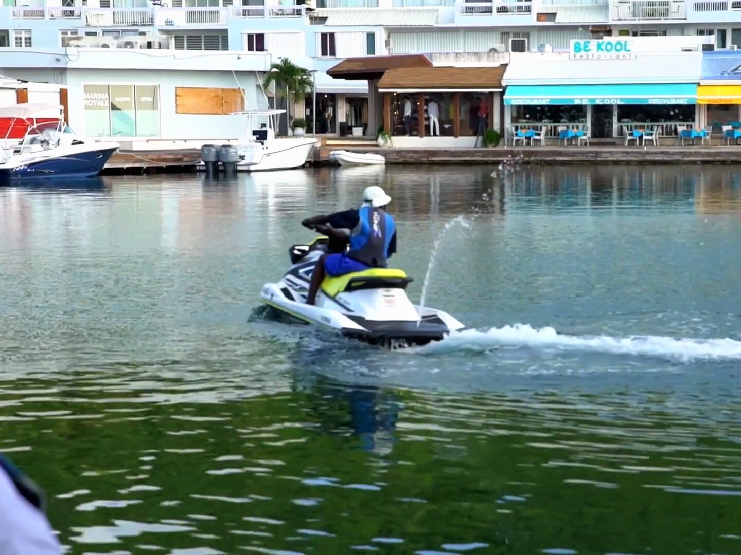 A jet ski pulls away from the Marina Royale pontoon